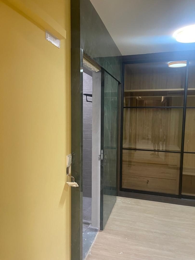 Aluminium cabinet with black-framed glass doors