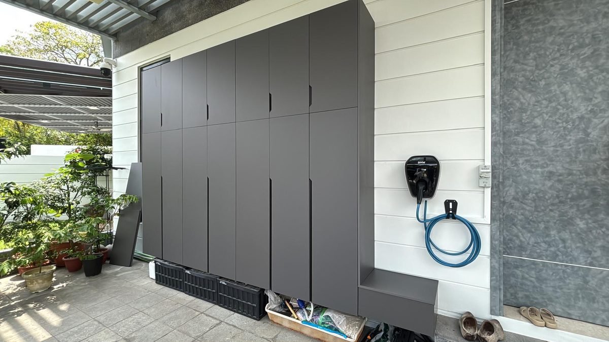 Grey aluminium storage cabinet wall beside a porch entrance